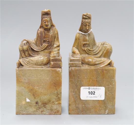 A pair of Chinese soapstone chops with seated figures height 16cm
